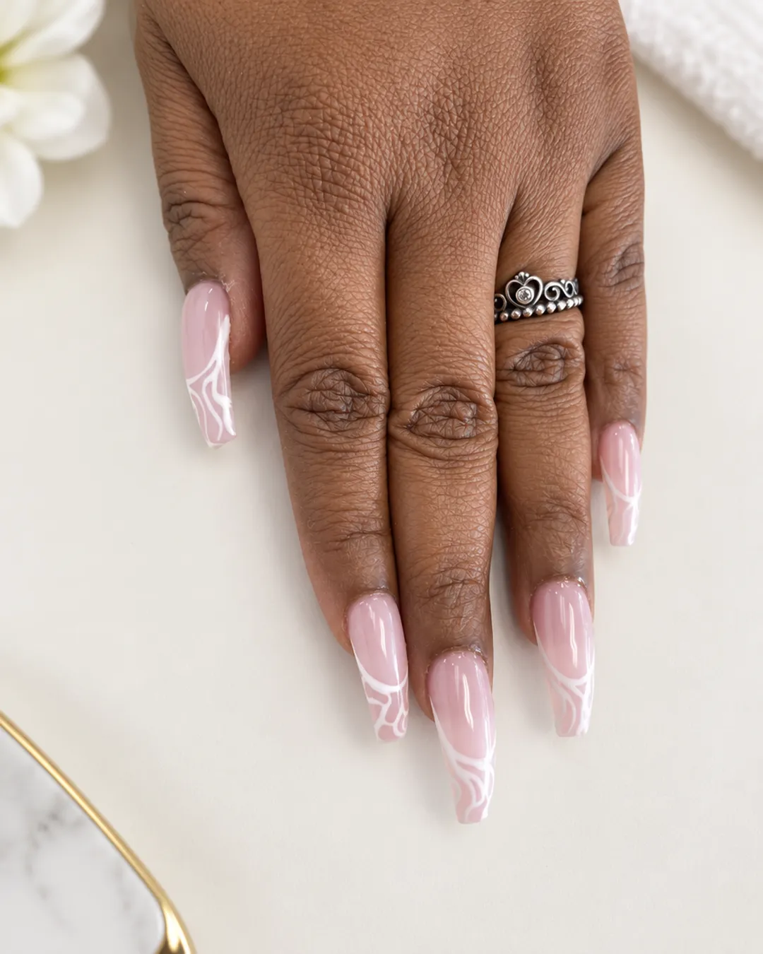 Long sheer pink nails with fine white line art