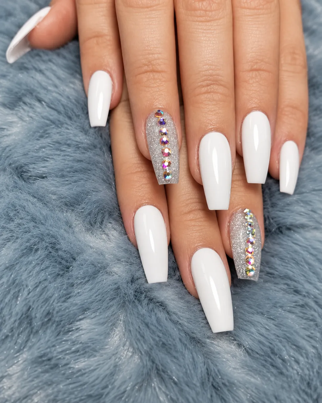 Milky white coffin nails with rhinestone accent nails