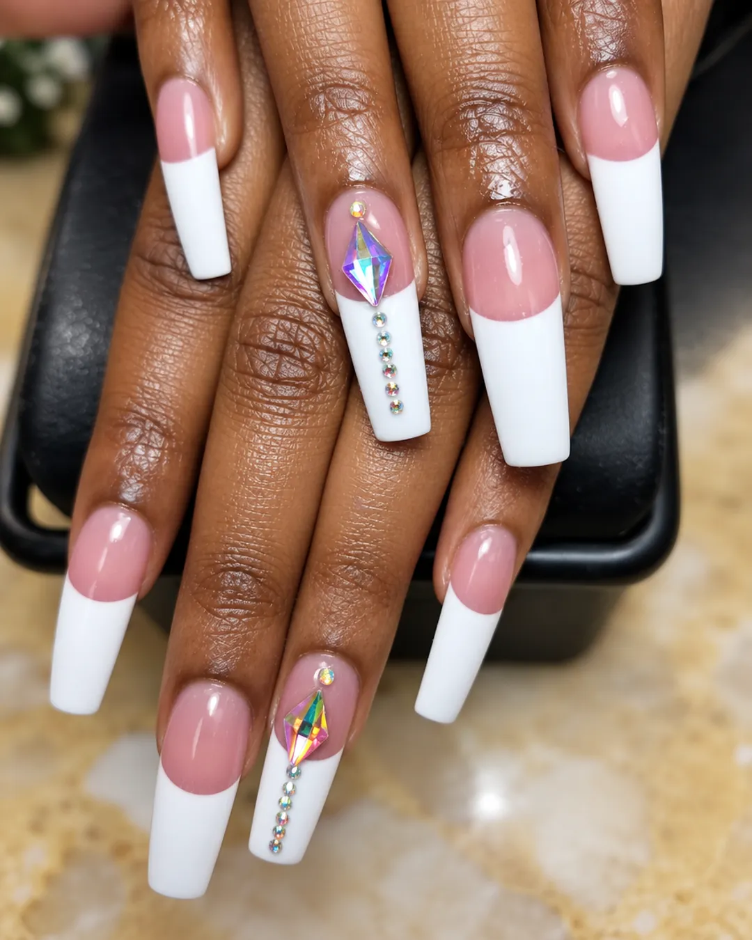 Deep white French tip coffin nails with a crystal gem accent