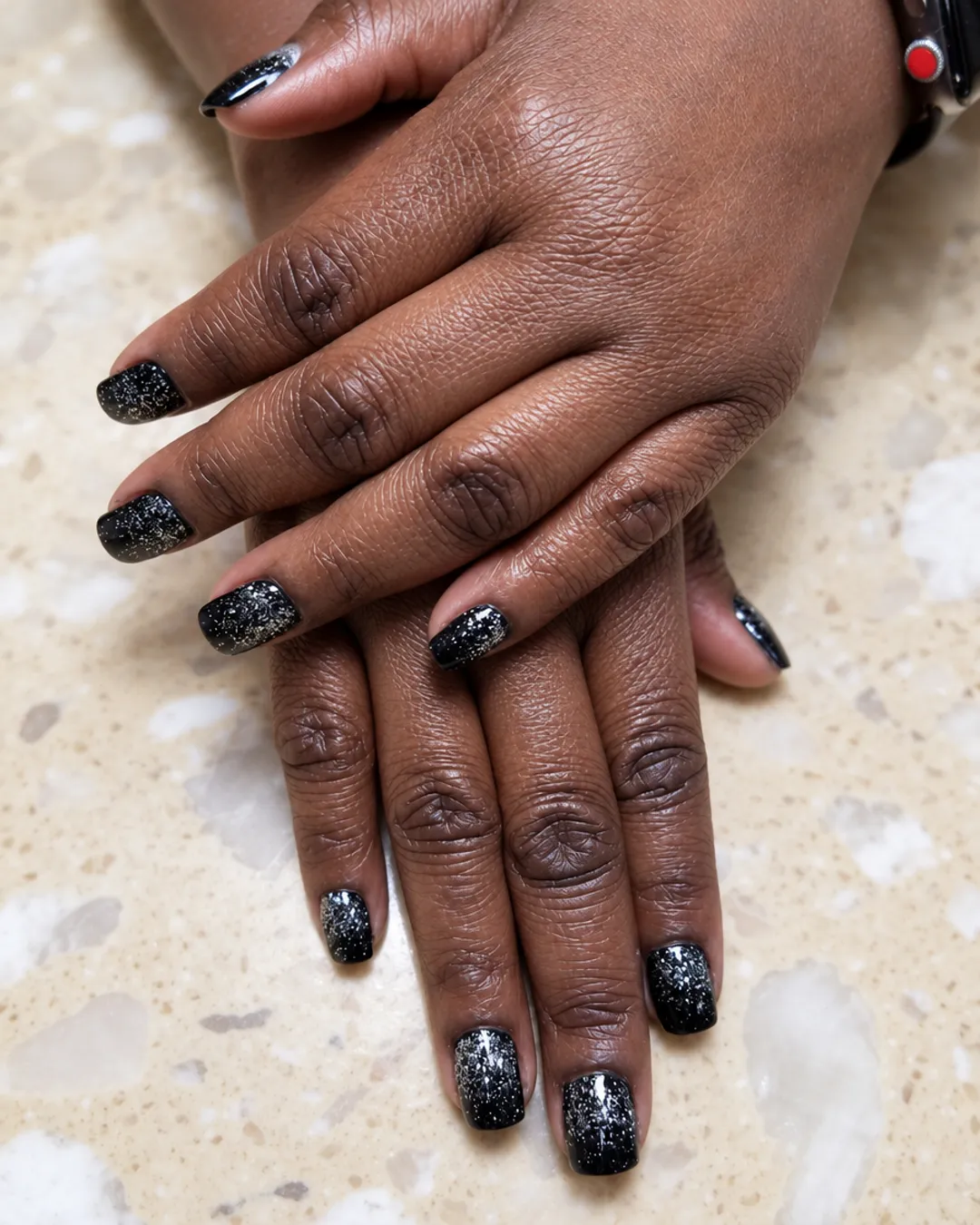 Short nails with a black-to-silver glitter fade