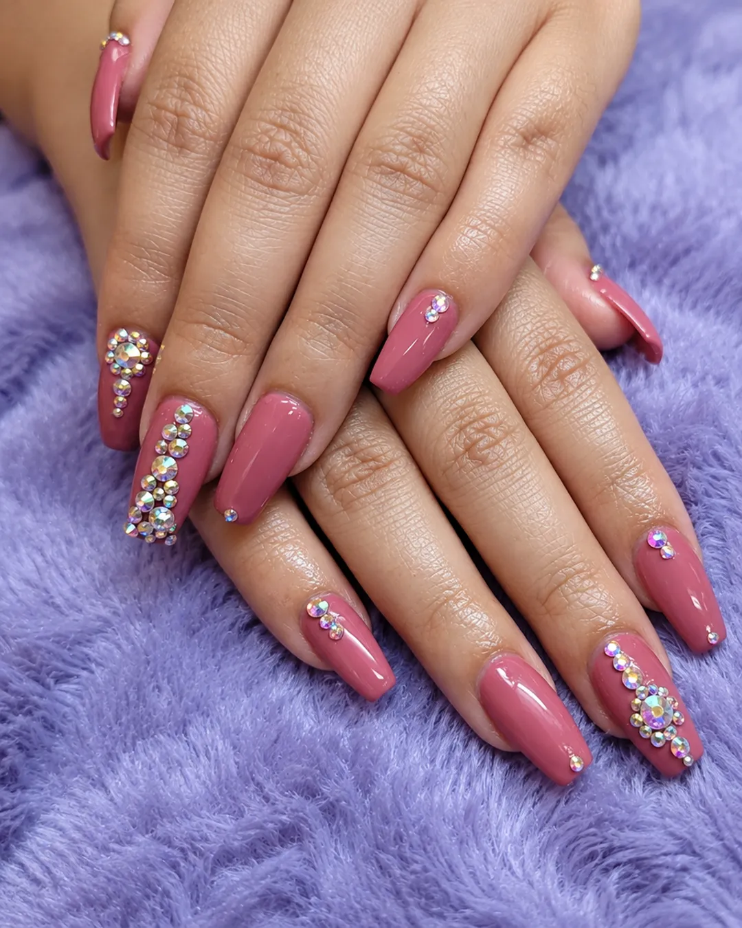 Mauve almond nails with crystal rhinestone accents