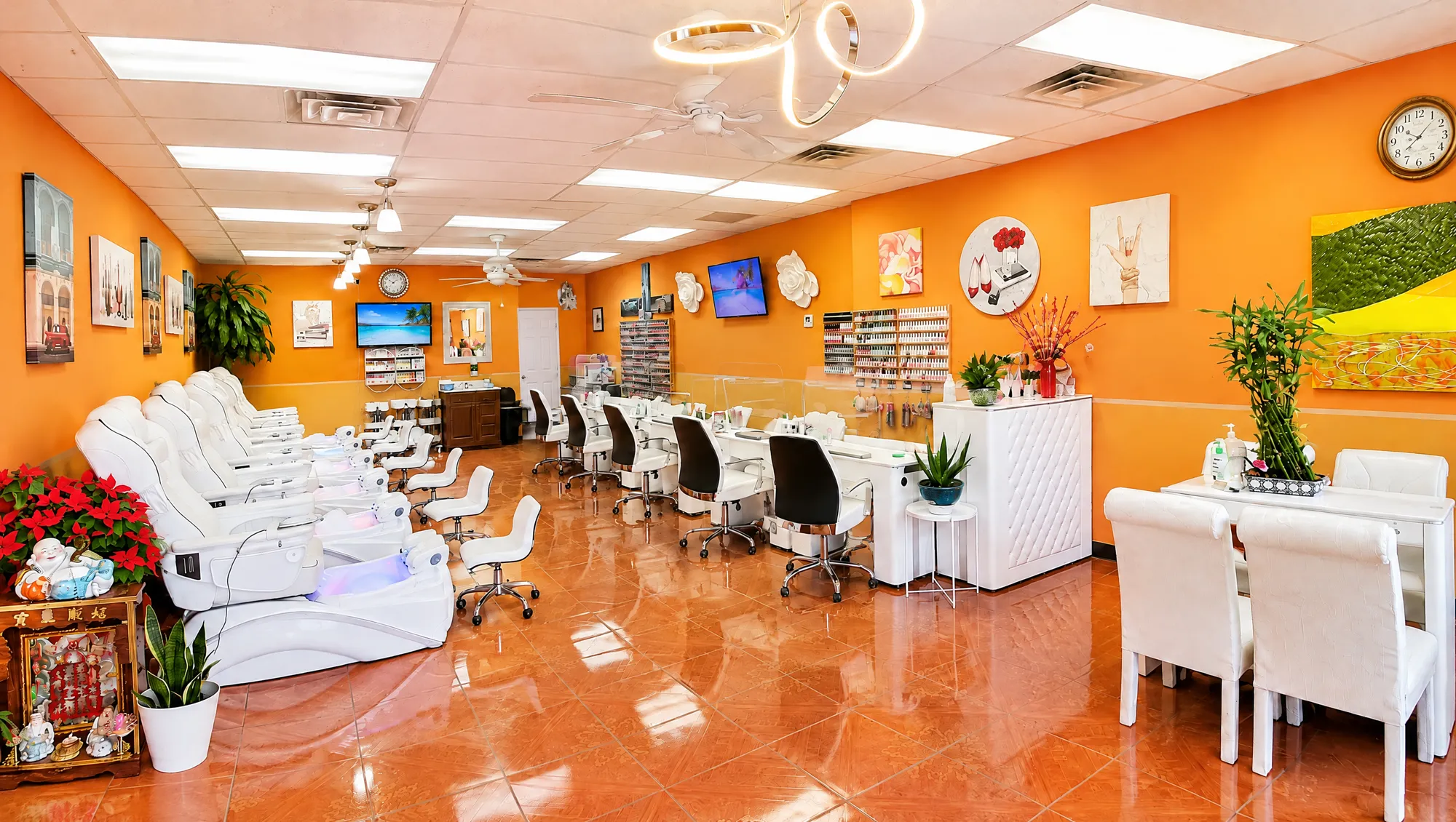 Inside Top Creative Nails: white pedicure spa chairs, manicure stations and a wall of polish